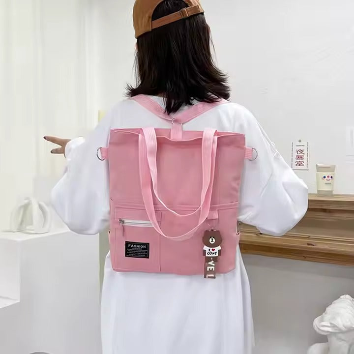 Cute canvas student bag with double shoulder straps and key ring with bear pendant