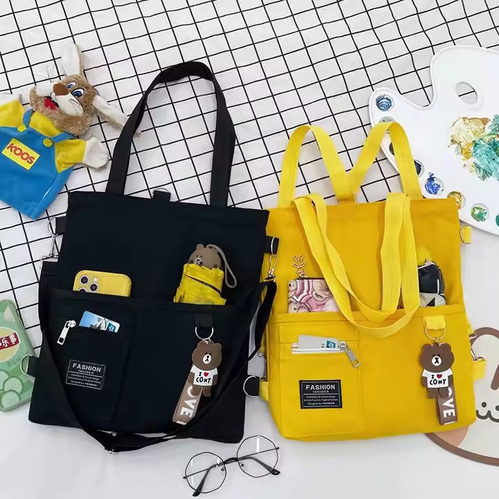 Cute canvas student bag with double shoulder straps and key ring with bear pendant