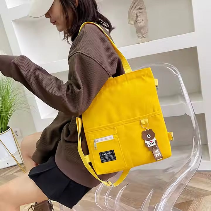 Cute canvas student bag with double shoulder straps and key ring with bear pendant